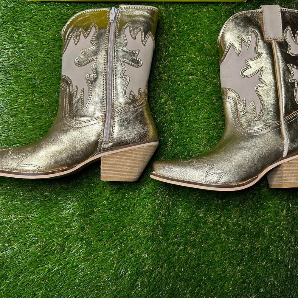 Very volatile gold metallic cowboy